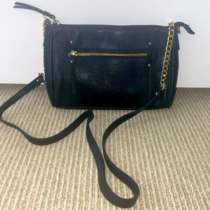 Black cross-body purse with gold chain detail